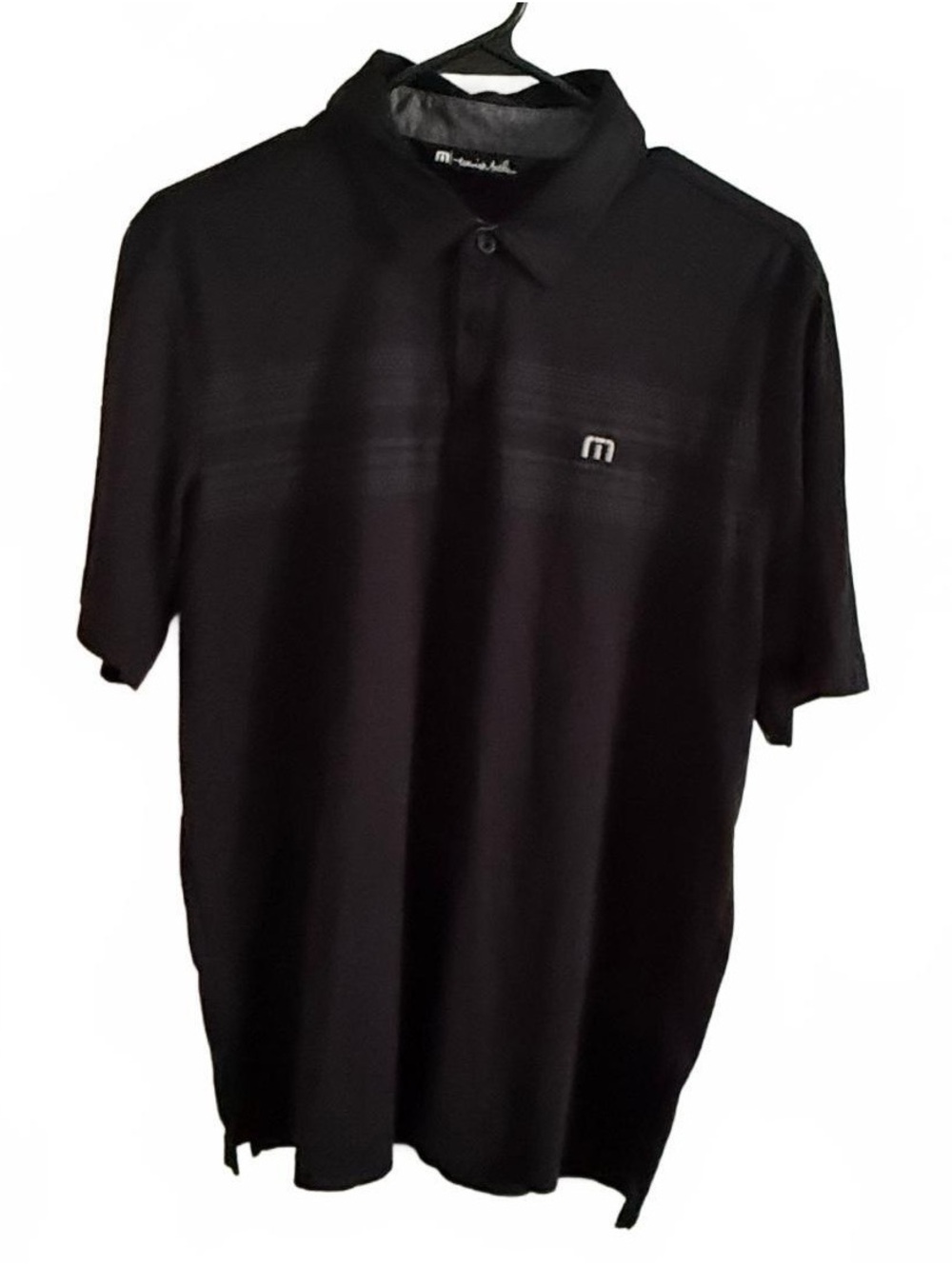 TravisMathew Black Polo Shirt with Subtle Horizontal Stripe Detail